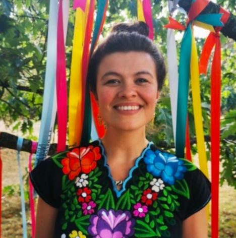 Nessie smiling among colourful ribbons